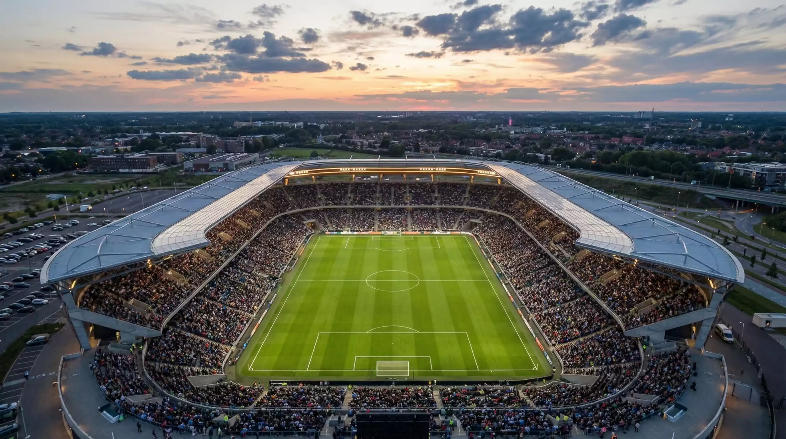 Futuristisches Fußballstadion mit moderner Architektur bei Sonnenuntergang